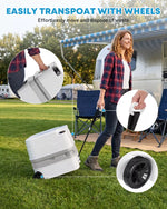 Person using a portable toilet for camping with wheels in an outdoor setting.